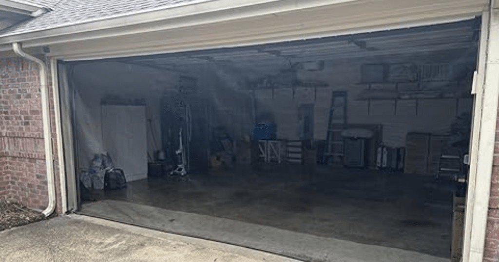 Black screen covering a garage