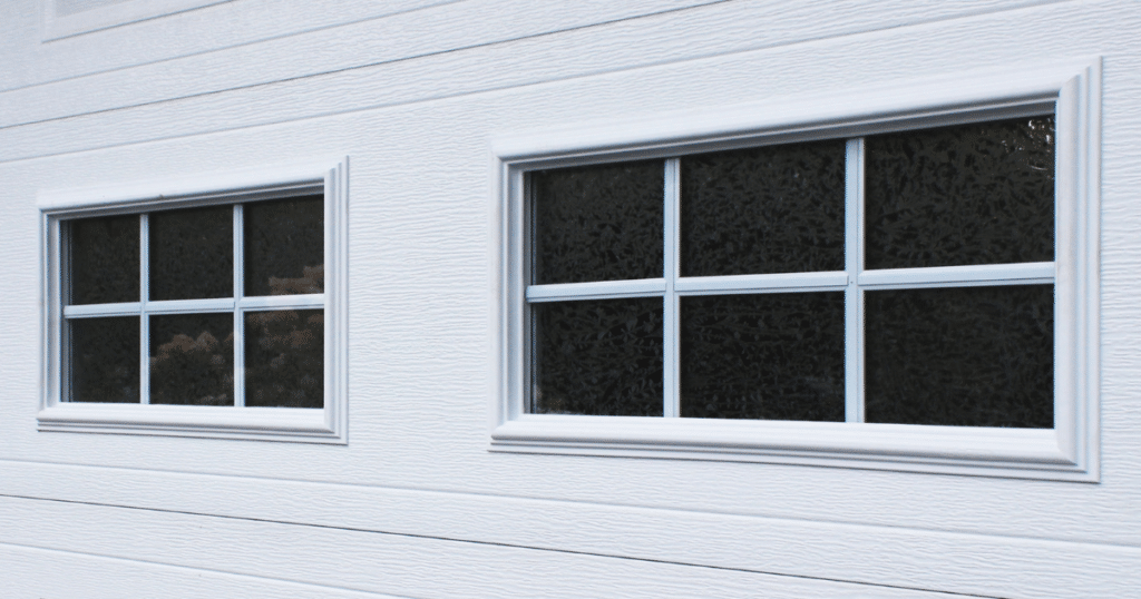 White garage door with decorative window panels.